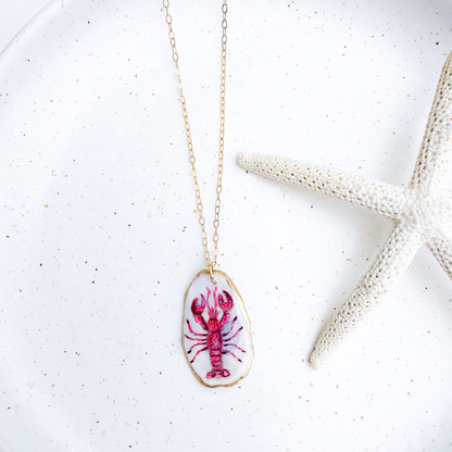 Hand-painted red lobster motif oyster shell necklace with gold-filled chain by Northern Tides Studio