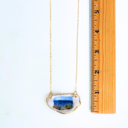 Beach roses motif oyster shell necklace shown in gift-ready packaging