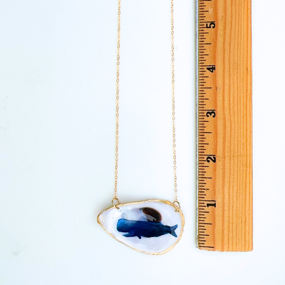 Whale motif oyster shell necklace shown in gift-ready packaging