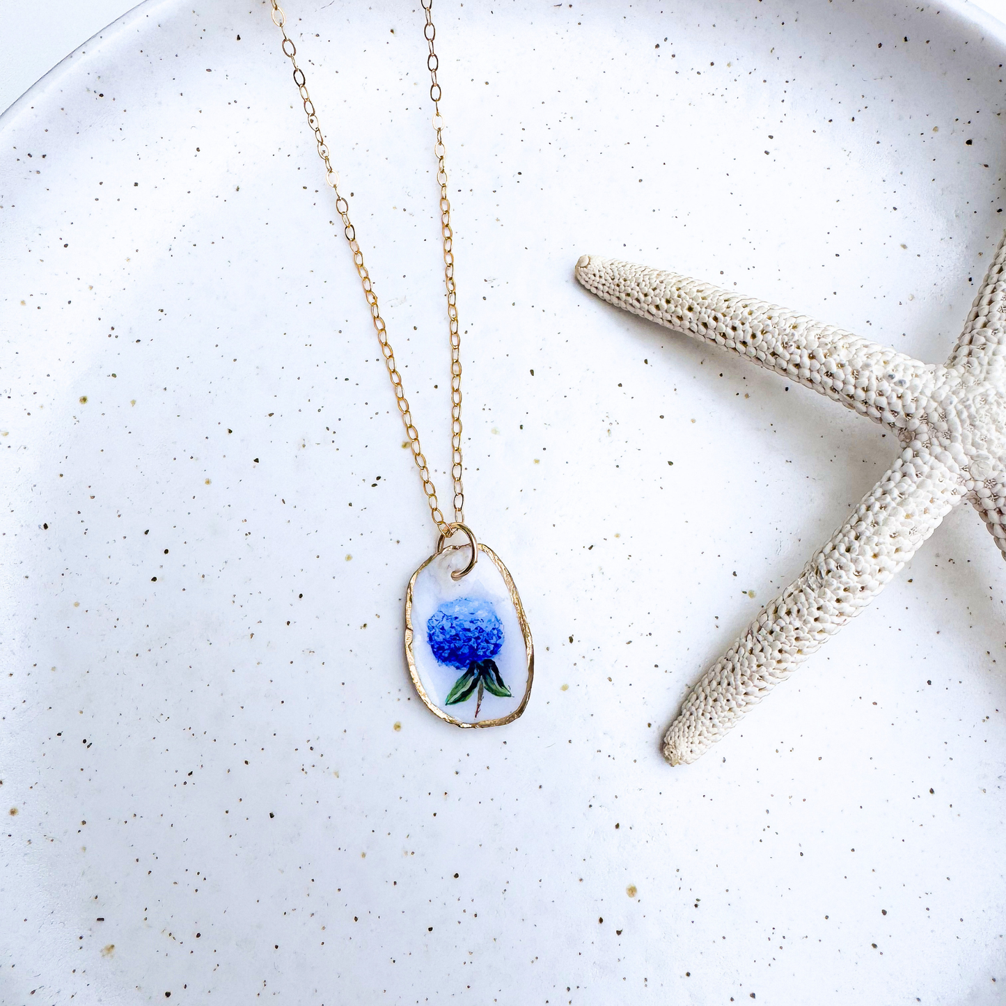 Hand-painted hydrangea motif oyster shell necklace with gold-filled chain by Northern Tides Studio