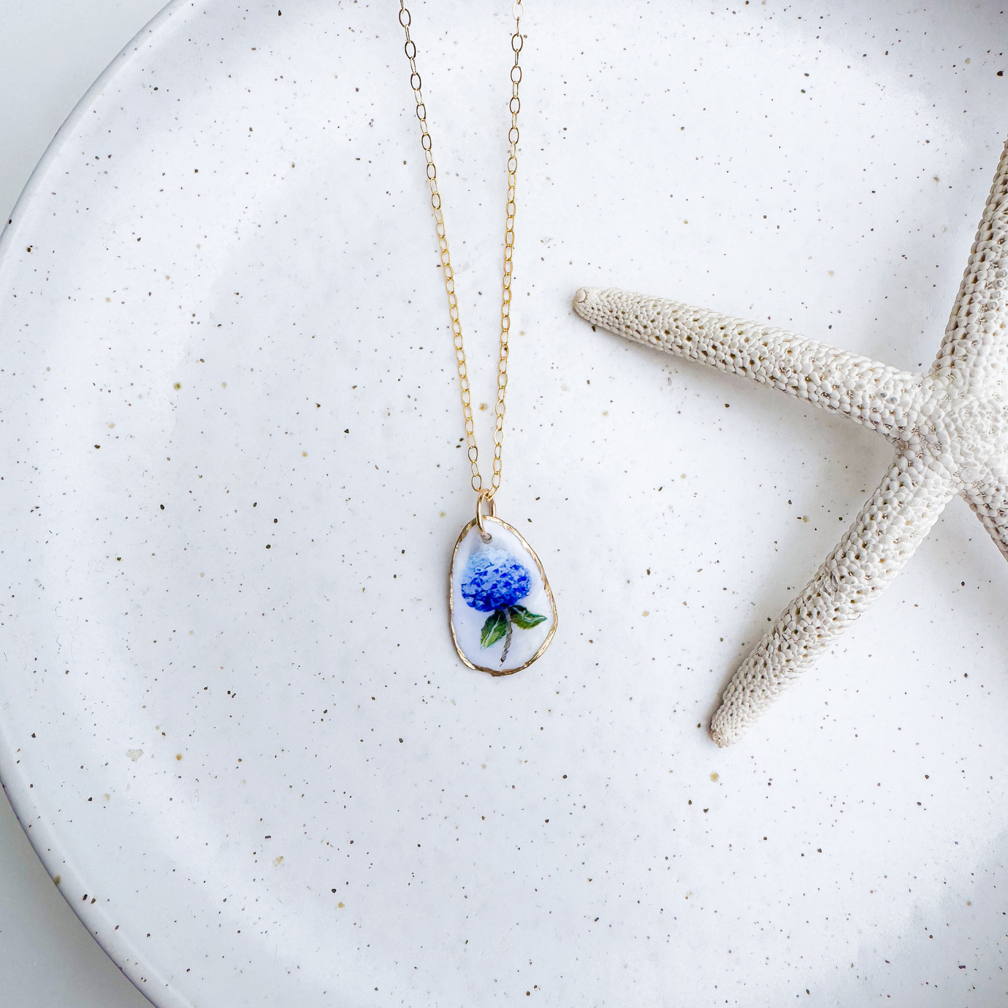 Hand-painted hydrangea motif oyster shell necklace with gold-filled chain by Northern Tides Studio